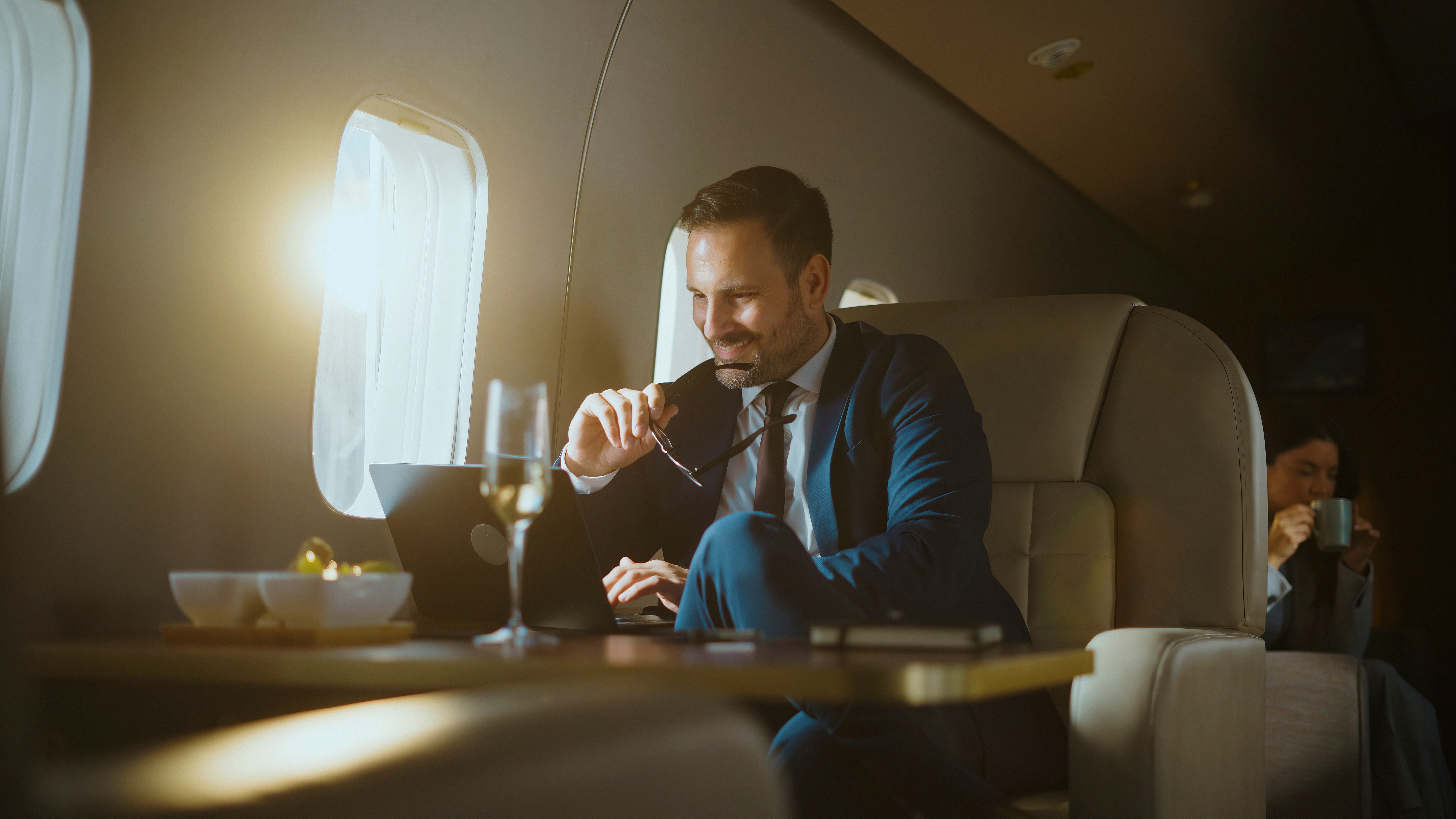 A business leader reviewing his work while travelling